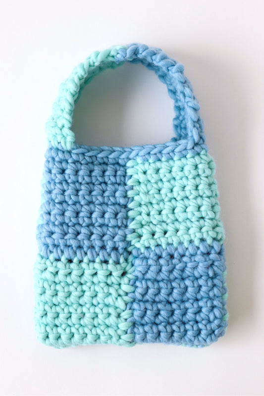 Blue and turquoise checkered crochet bag handmade with wool yarn.