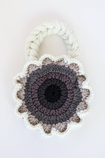 Flower shaped gray ombré crochet shoulder bag handmade with acrylic yarn.