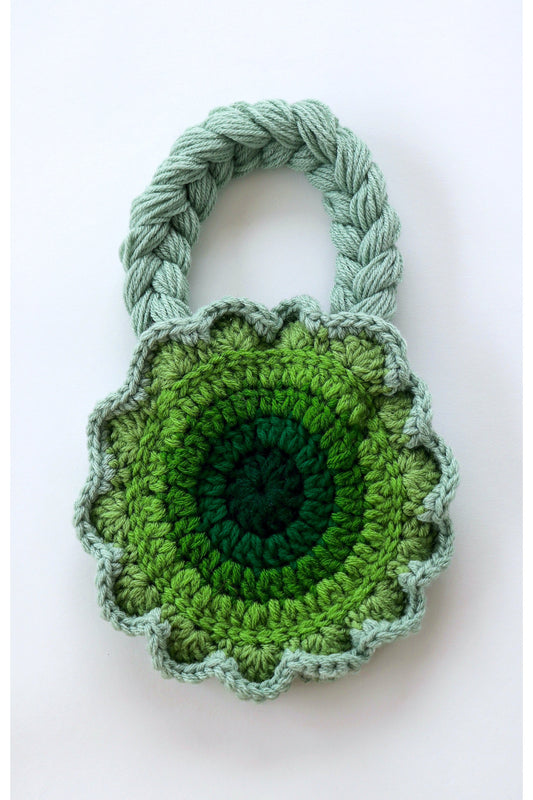 Flower shaped green ombré crochet shoulder bag handmade with acrylic yarn.