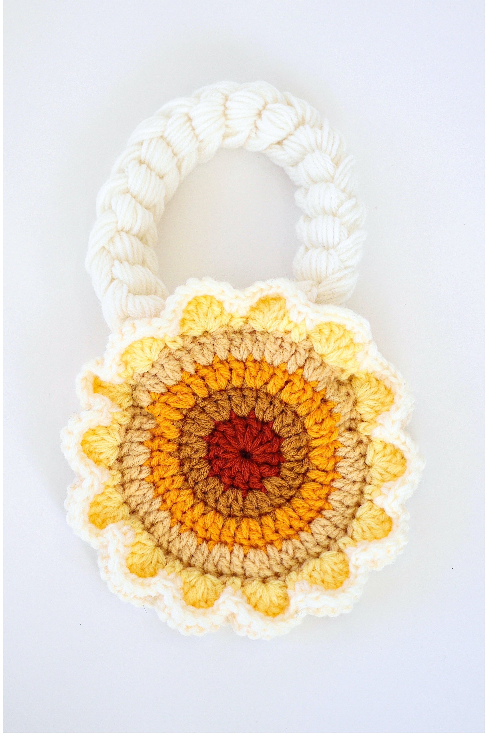 Flower shaped yellow ombré crochet shoulder bag handmade with acrylic yarn.