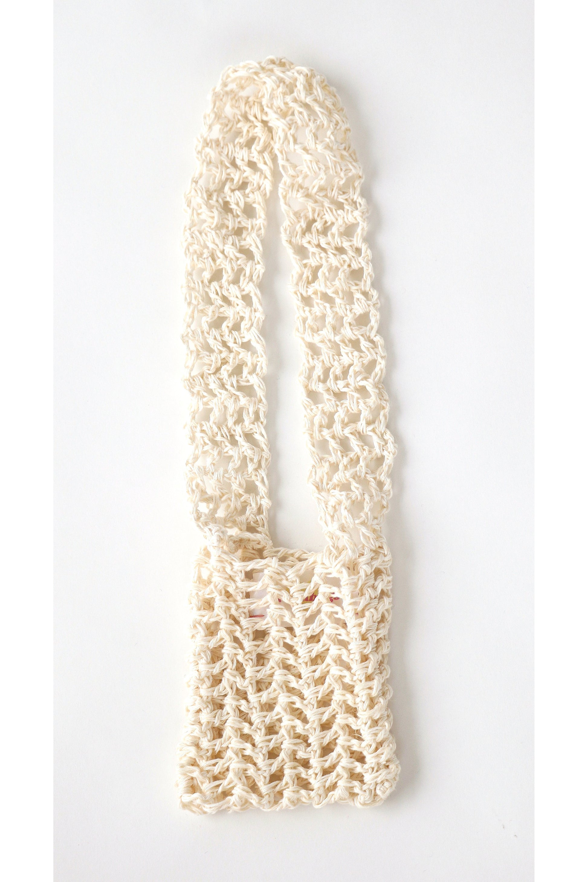 Crochet fishnet style crossbody pouch in cream handmade with linen yarn.