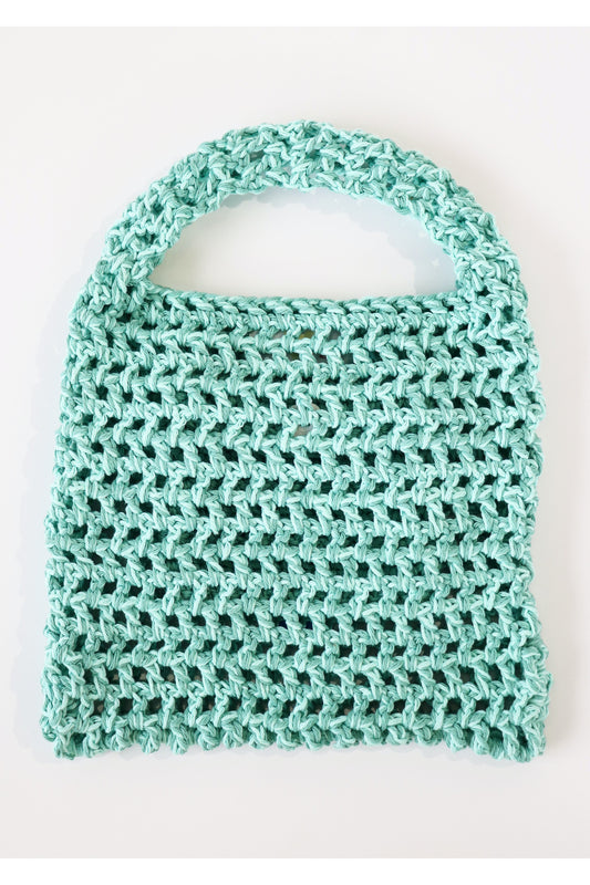 Front of Caribe color way two-tone crochet fishnet tote bag handmade with cotton yarn.