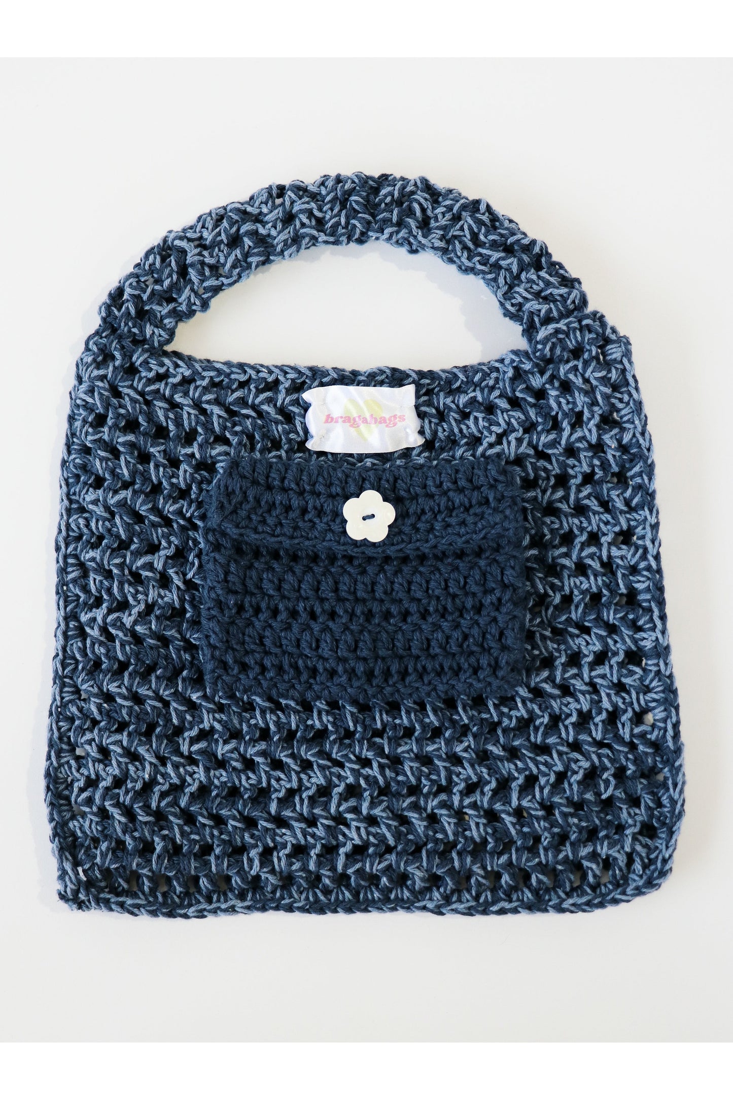 Inside of Denim color way two-tone crochet fishnet tote bag handmade with cotton yarn.