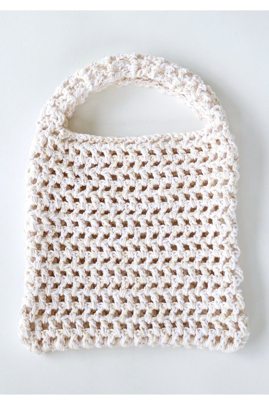 Front of Milk color way two-tone crochet fishnet tote bag handmade with cotton yarn.