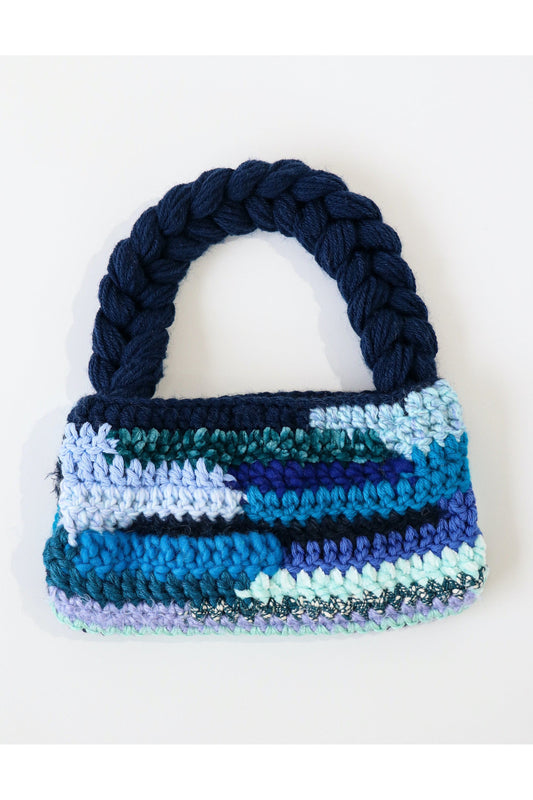 Blue color way crochet shoulder bag handmade with a variety of scrap yarn.