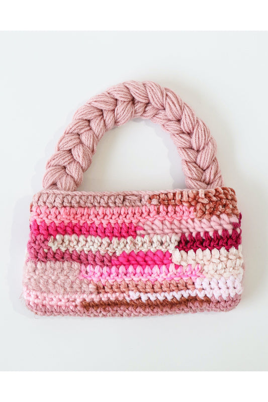 Pink color way crochet shoulder bag handmade with a variety of scrap yarn.