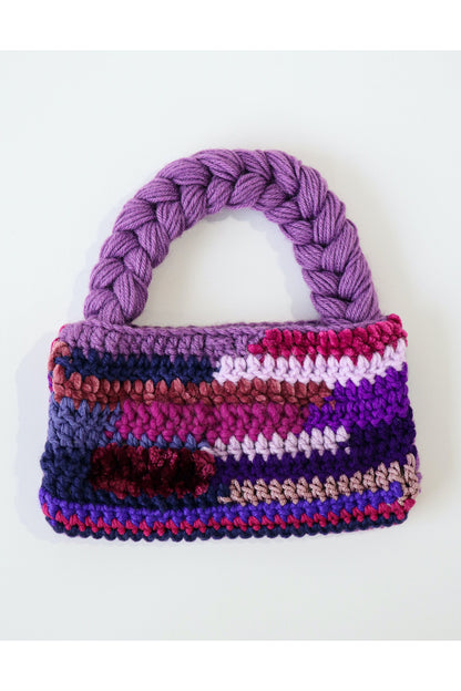 Purple color way crochet shoulder bag handmade with a variety of scrap yarn.